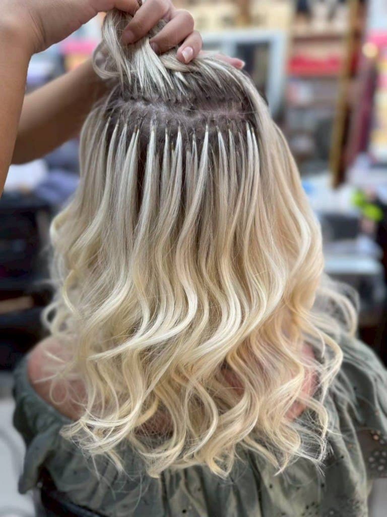 Platinum blonde hair colour with soft waves at House of Beauty Phuket