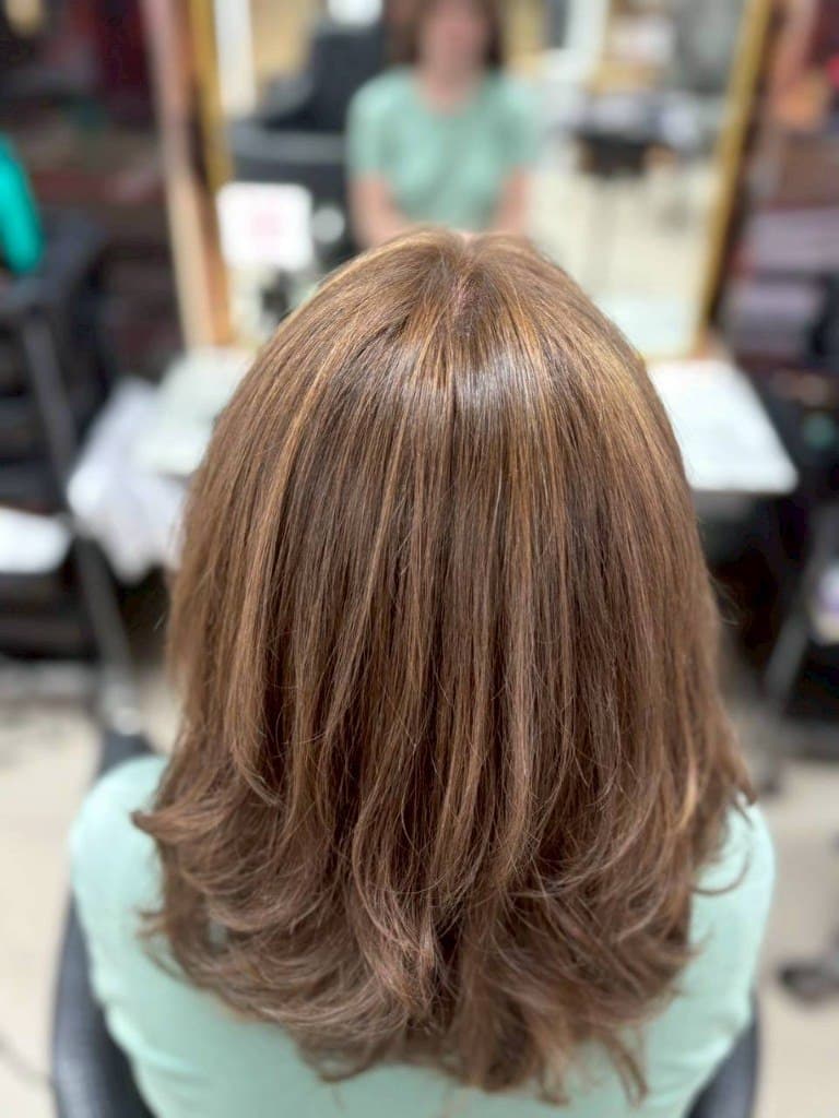 Honey brown highlights with wavy styling at House of Beauty Phuket